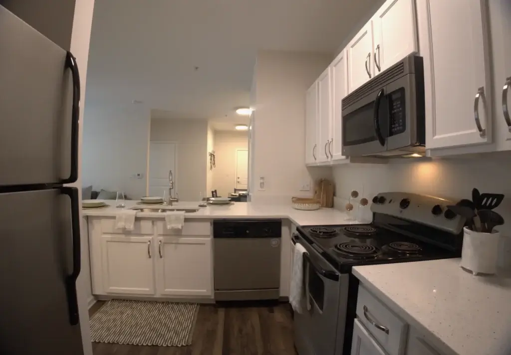 Cook with Ease in Spacious Kitchens Featuring Modern Appliances and Breakfast Bars Image