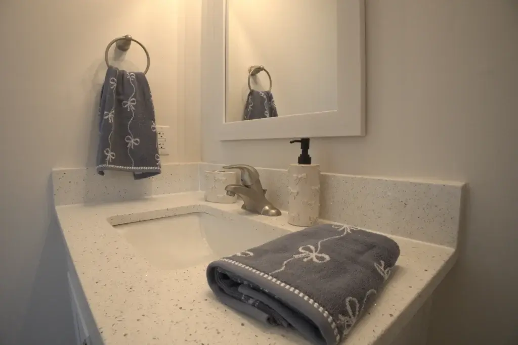 Designer Bathroom Finishes with Quartz Counters and Modern Fixtures Image